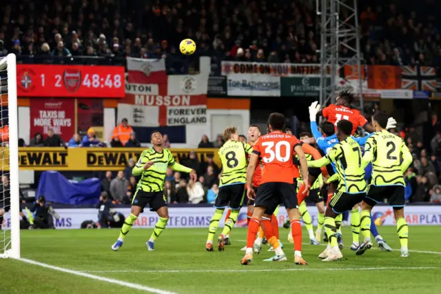 Elijah Adebayo heading the ball from a corner