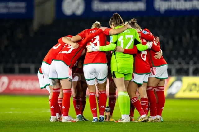 Wales players in a huddle before their game against Germany