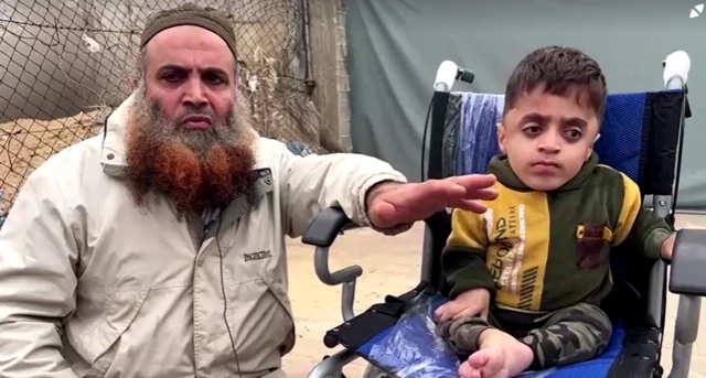 Zaher on the left crouching and Zakaria Shada in his wheelchair