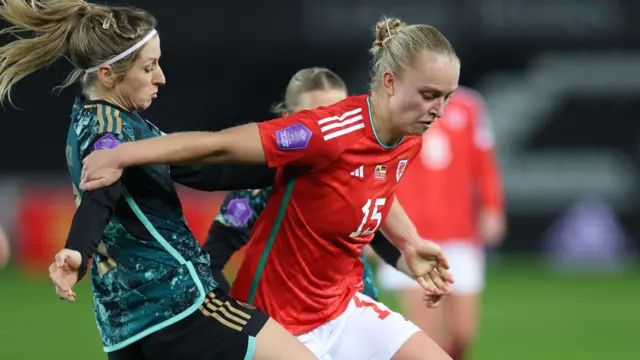 Elise Hughes (right) attacks for Wales