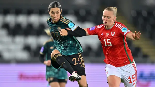 Germanys' Sara Doorsoun (left) battles with Wales' Elise Hughes