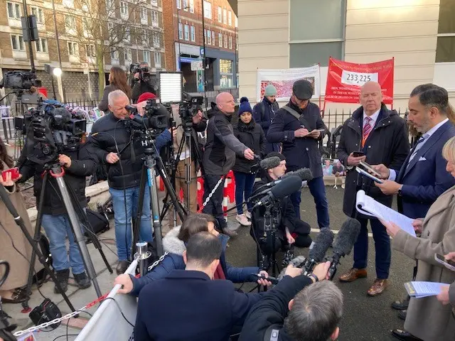 A representative for a bereaved families group addresses the press