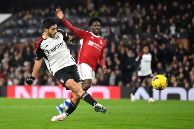 Jimenez shoots for his goal v Forest.