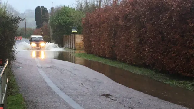 Car driving through flood water