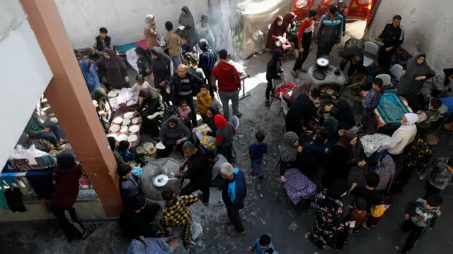 Top shot of people cooking in a school