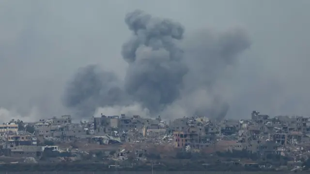 Smoke rises above Gaza's Shejaiya neighbourhood following an Israeli air strike