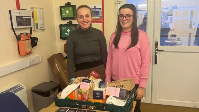 Wincanton Racecourse staff with food that will be donated to a local food bank