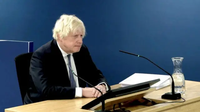 Former British Prime Minister Boris Johnson gives evidence at the Covid Inquiry