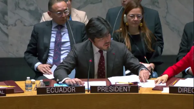 The representative for Ecuador reading from a document