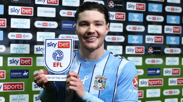 Callum O'Hare poses with his player of the match award