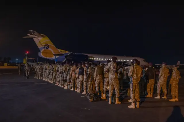 Members of the South Sudan People's Defence Force of the East African Community Regional Force (EAC-RF) prepare to leave the Democratic Republic of Congo at Goma airport on December 8, 2023.