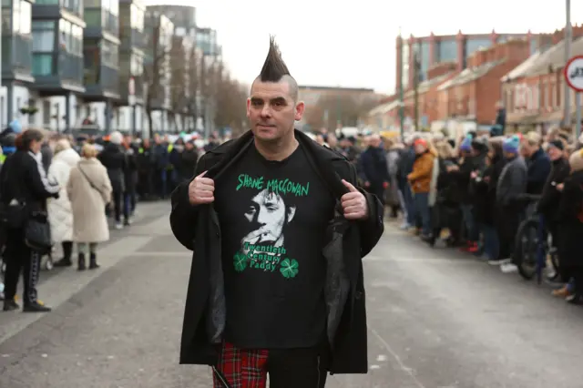 John Farrell outside Shelbourne Park Stadium waits for the funeral procession of Shane MacGowan to makes its way through the streets of Dublin