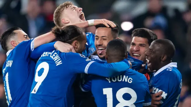 Dwight McNeil is mobbed by his Everton team-mates after scoring against Newcastle