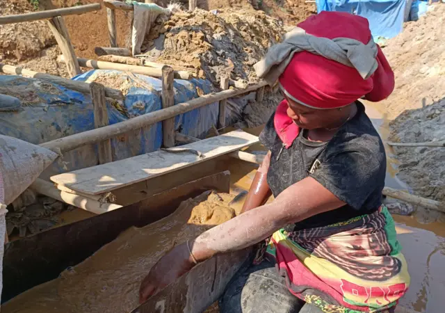 A woman mining cobalt in the DR Congo.