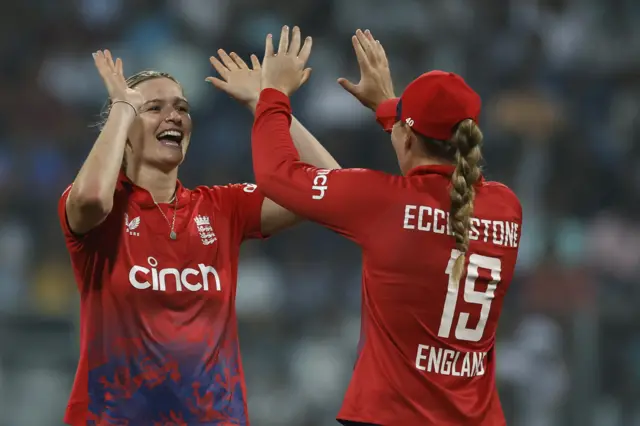 Lauren Bell celebrates a wicket with Sophie Ecclestone