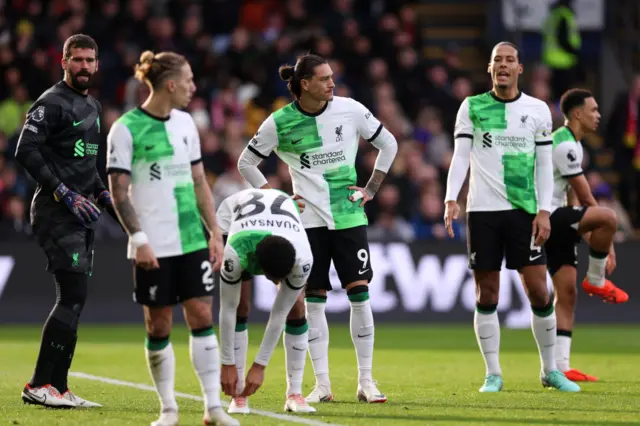 lisson Becker, Kostas Tsimikas, Darwin Nunez and Virgil van Dijk of Liverpool react after conceding