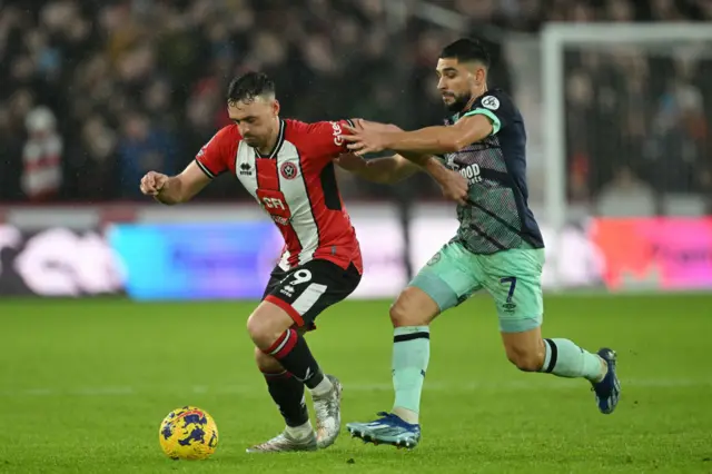 Jack Robinson is challenged by Neal Maupay