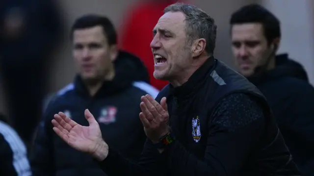 Port Vale boss Andy Crosby urges his side on