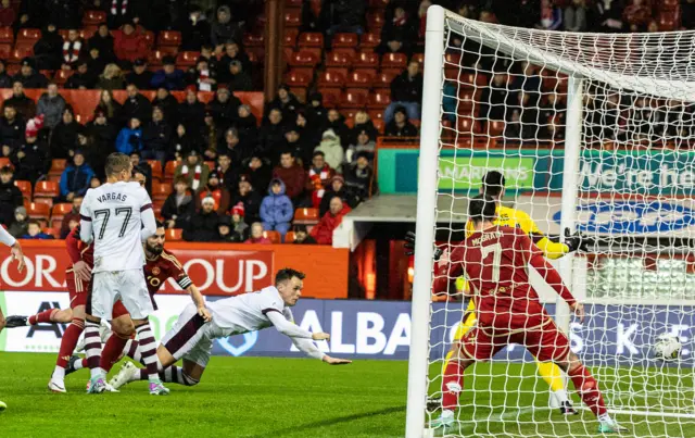 Lawrence Shankland heads Hearts in front against Aberdeen