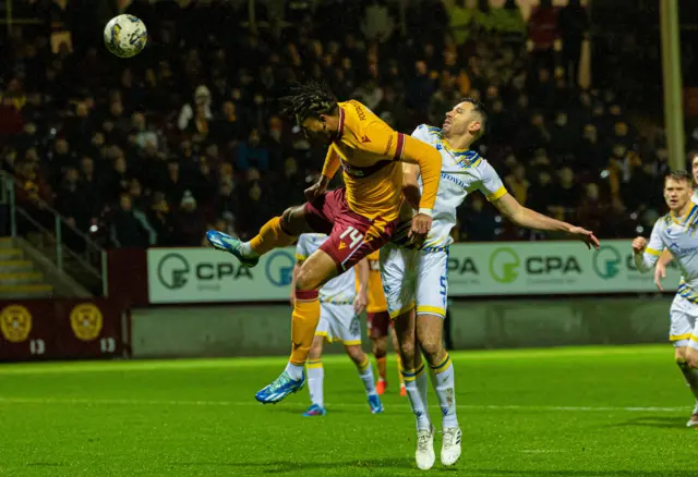 Theo Bair powers a header at goal