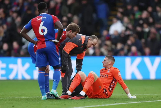 Sam Johnstone receives medical attention after sustaining an injury