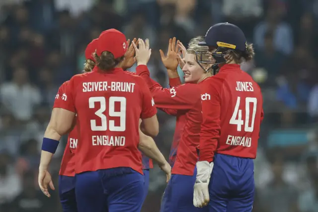 England's Charlie Dean celebrates taking a wicket