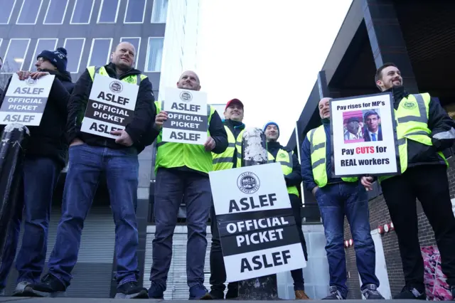 Asleft members at a picket line outside London Euston station