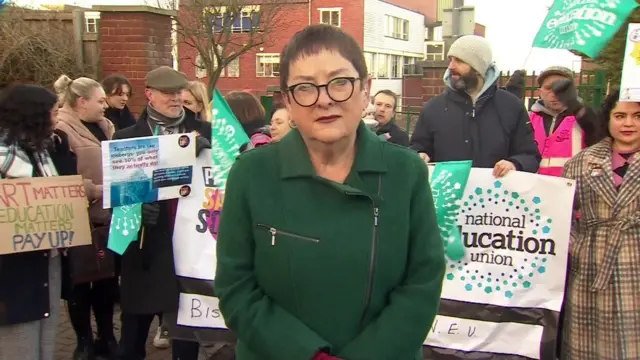 Dr Mary Bousted stands next to a school picket line