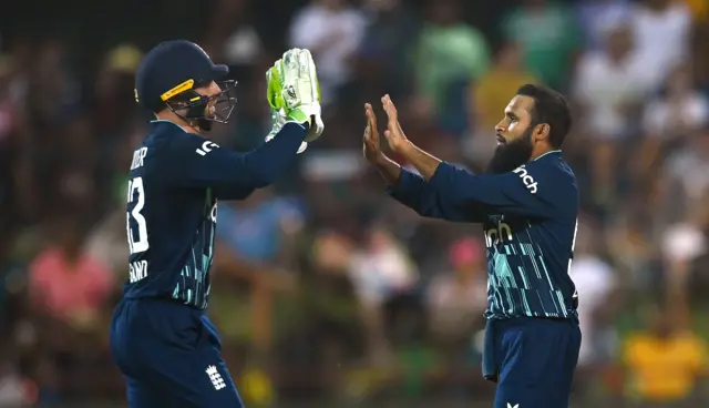 Adil Rashid celebrates with Jos Buttler