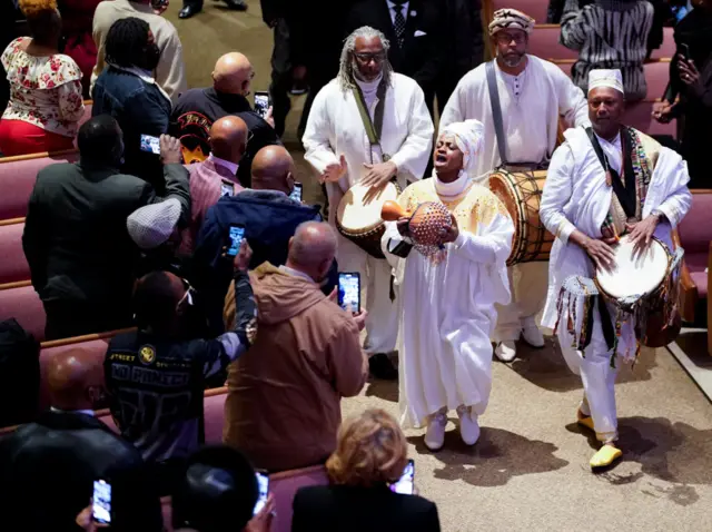 Singers enter church