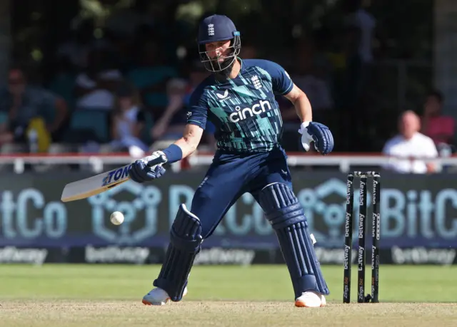 Moeen Ali tries a one-handed shot