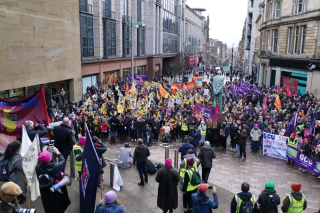 Protesters gather to listen to speakers at the Protect The Right To Strike rally organised by the STUC, at the Donald Dewar Steps on Buchanan Street, Glasgow.