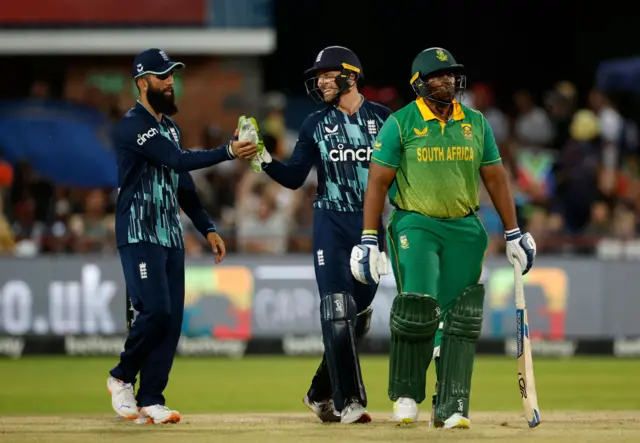 England celebrate the wicket of Sisanda Magala