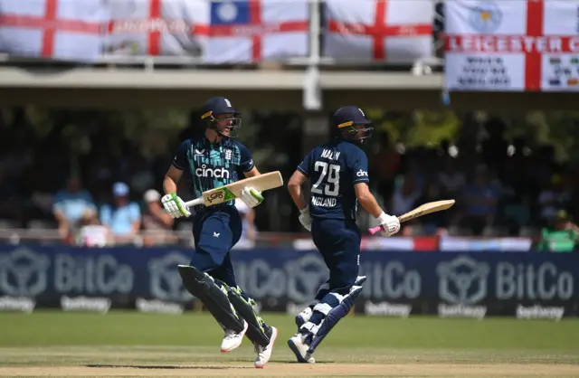 England batsmen Jos Buttler (l) and Dawid Malan run between the wickets during the 3rd ODI match between South Africa and England at De Beers Diamond Oval