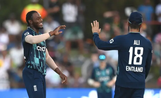 Jofra Archer celebrates with Moeen Ali