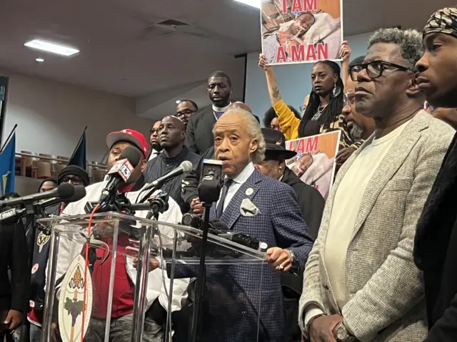 Rev Al Sharpton speaking at podium