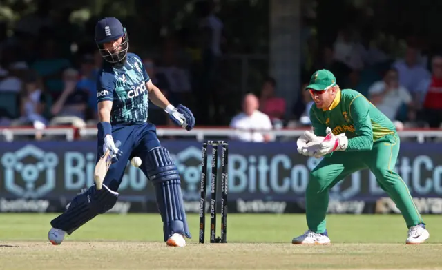 Moeen Ali tries a one-handed shot