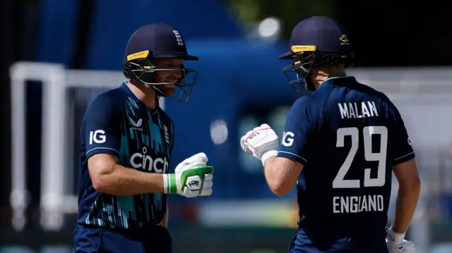 Jos Buttler and Dawid Malan tap gloves