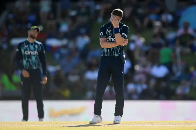 Chris Woakes with his head in his hands