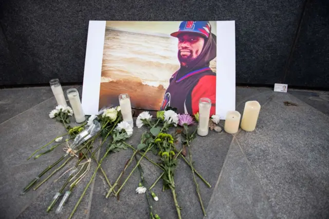 A memorial is displayed for Tyre Nichols at the Embrace statue in Boston, Massachusetts, on January 28, 2023.