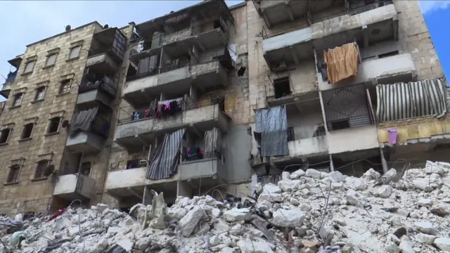 The impact of the quake seen on a damaged building in Aleppo