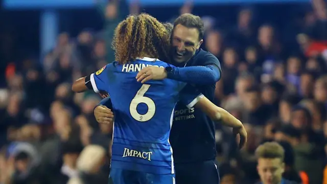 Hannibal Mejbri and Birmingham boss John Eustace.