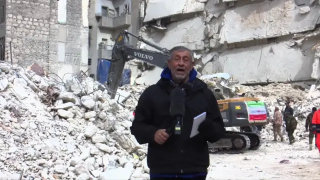 BBC Arabic Correspondent, Assaf Abboud, stood in front of rubble in Aleppo