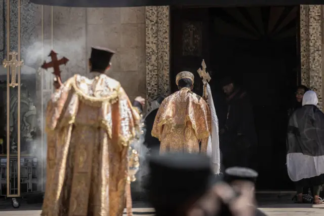 High priests pray at Saint Mary Church in Addis Ababa, Ethiopia, during a day of mourning on 6 February.