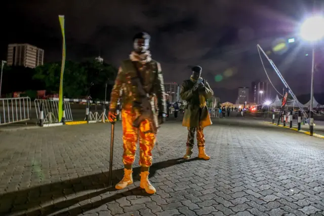 Kenya police officers on guard during a Fireworks display at K.I.C.C for the New Years celebrations on January 01, 2023 in Nairobi, Kenya.