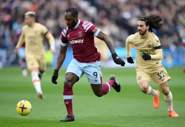 Michail Antonio of West Ham United is put under pressure by Marc Cucurella of Chelsea during the Premier League match between West Ham United and Chelsea FC at London Stadium