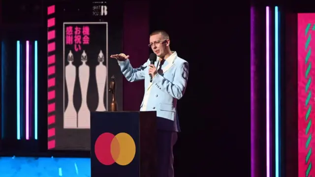 Aitch with his BRIT Award for Grime during the 2023 BRIT Awards ceremony at The O2 arena