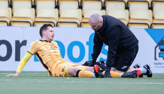 Bruce Anderson receives treatment on an injury