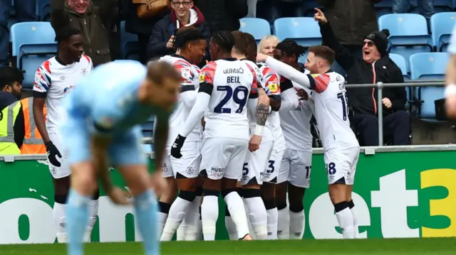 Luton celebrate taking the lead at Coventry