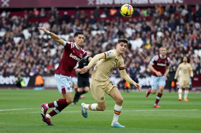 Kai Havertz of Chelsea is put under pressure by Nayef Aguerd of West Ham United during the Premier League match between West Ham United and Chelsea FC at London Stadium on February 11, 2023